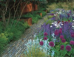Cor-Ten Steel, Stonework, Boxwood And Lush Planting. 
Garden Design
Calimesa, CA