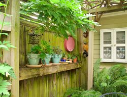 Plant Pots Displayed On Fence, Potted Plants On Shelf
Garden Design
Calimesa, CA