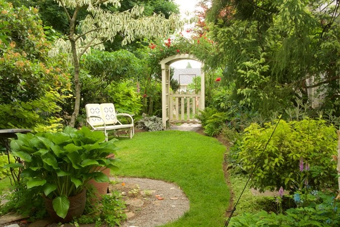 Secret garden gate entrance with arbor