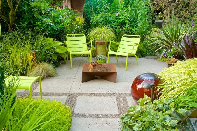 Urban secret garden patio with fire pit
