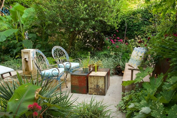 Secret garden seating area with vintage fountain